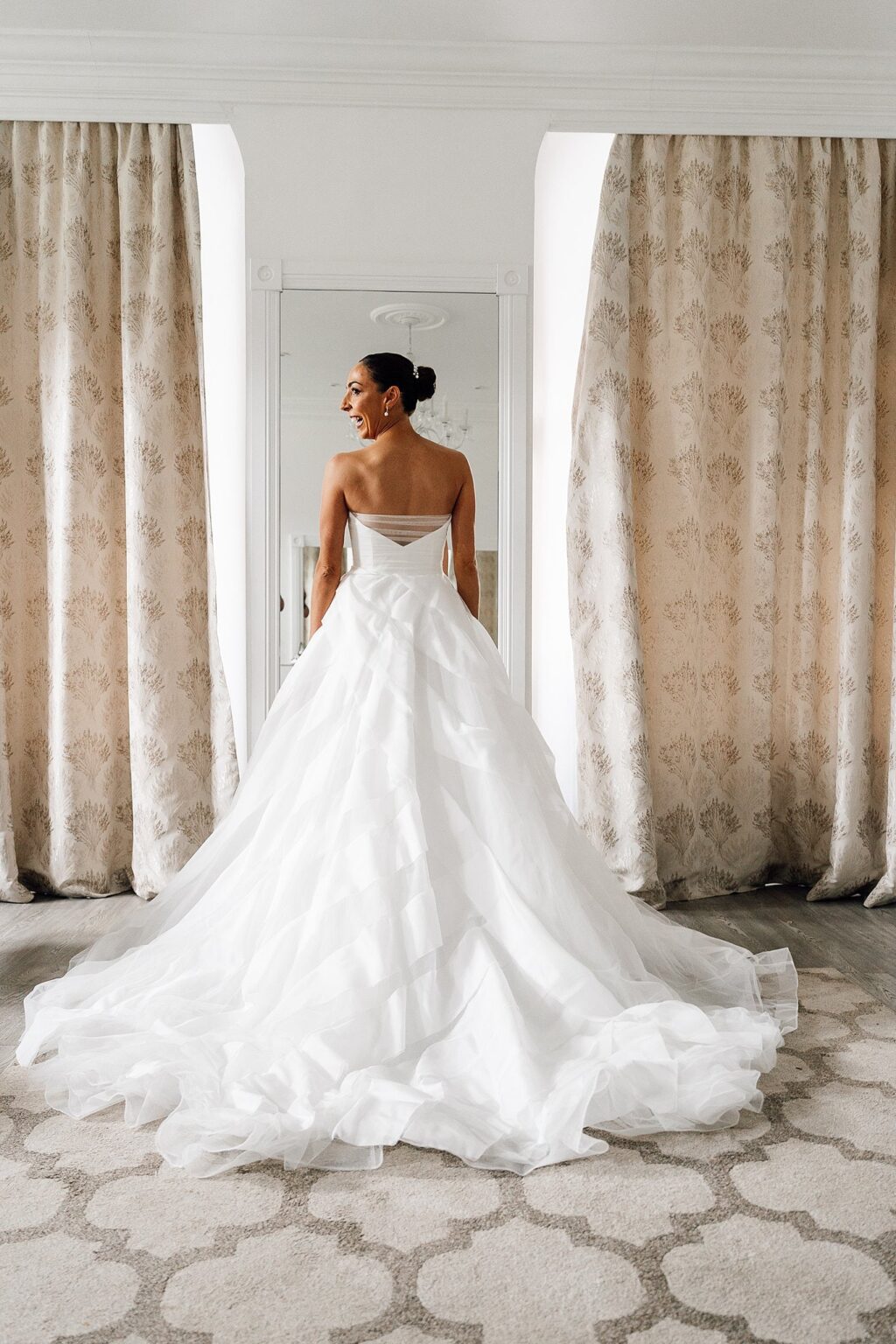 back of wedding dress with a beautiful bride waiting for her wedding ceremony