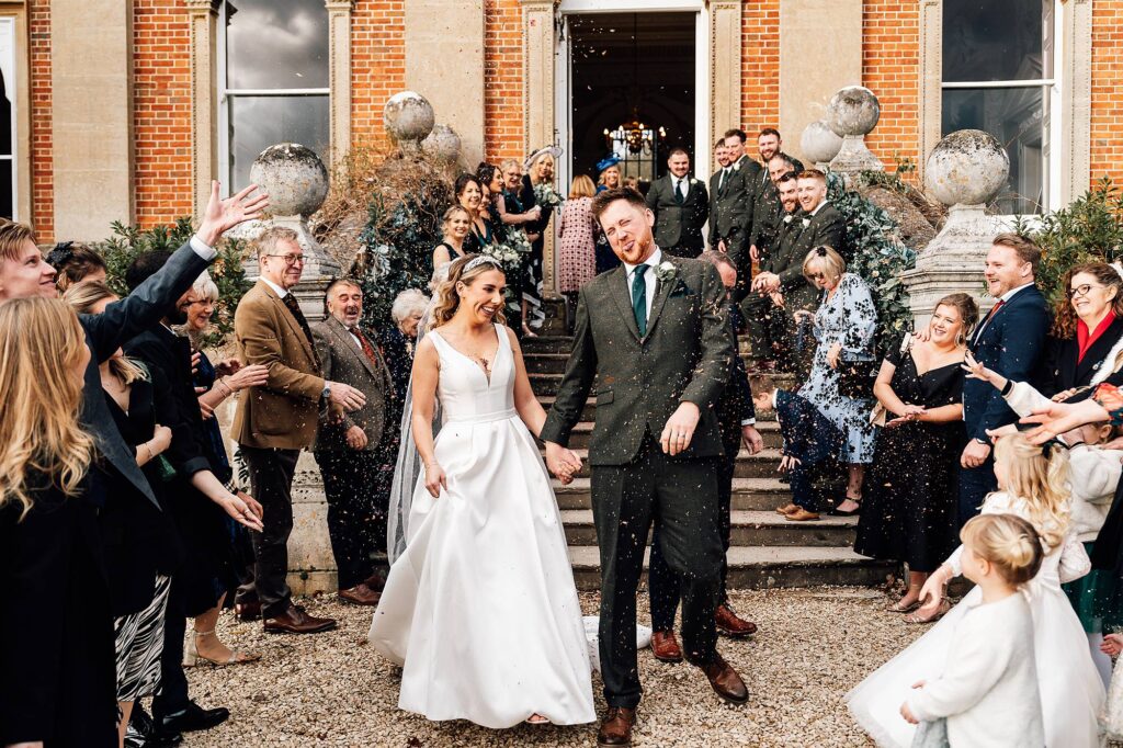 Groom spitting out confetti after it goes in his mouth